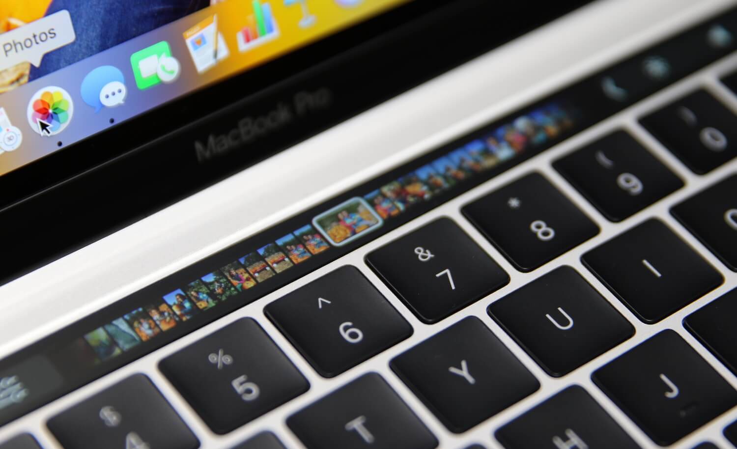 Which applications support the Touch Bar in the new MacBook Pro